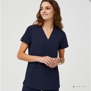 Navy blue AYA embroidered Casma scrub top.